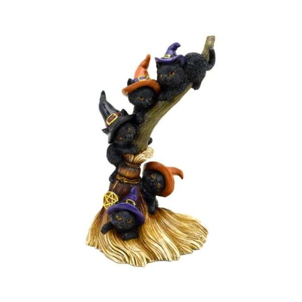 Witches cat climbing tree